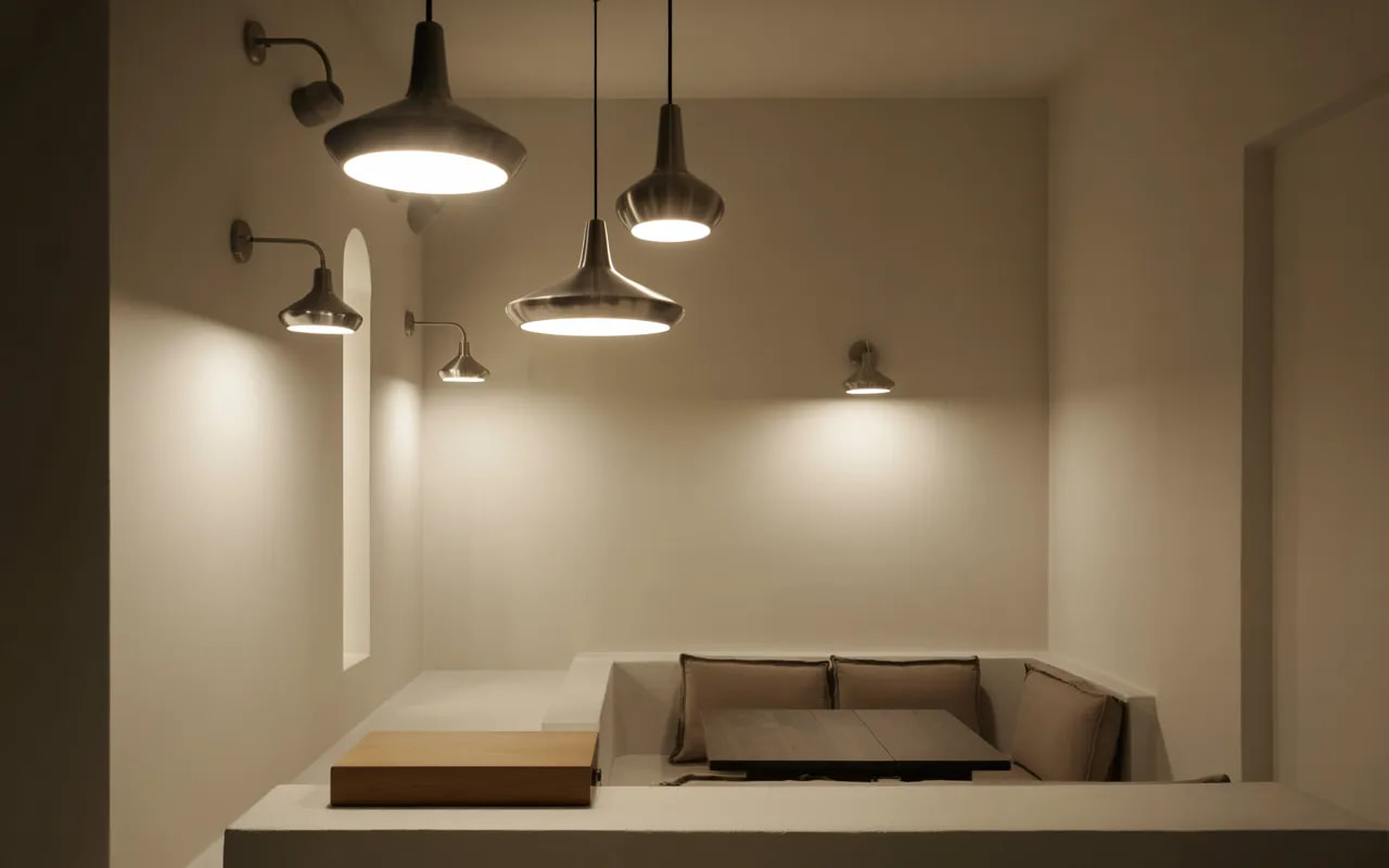 Small room with layered lighting, pendant lamps, wall sconces, bright ambient lighting, minimalist furniture, Pinterest-style interior photography”