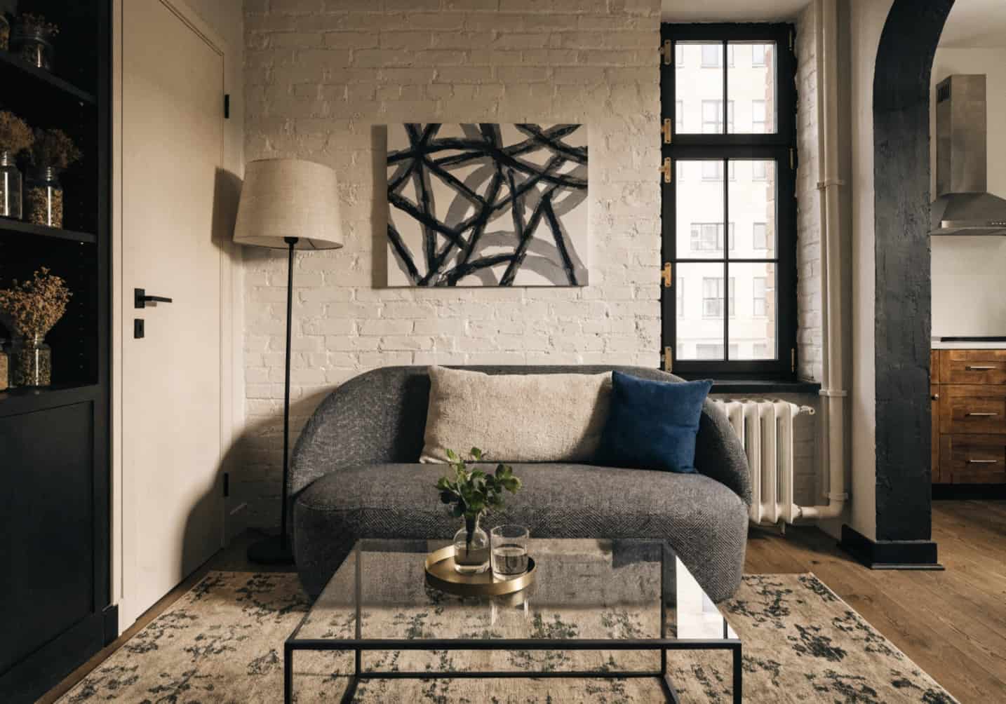 small living room with compact furniture, slim sofa, minimal coffee table, modern style