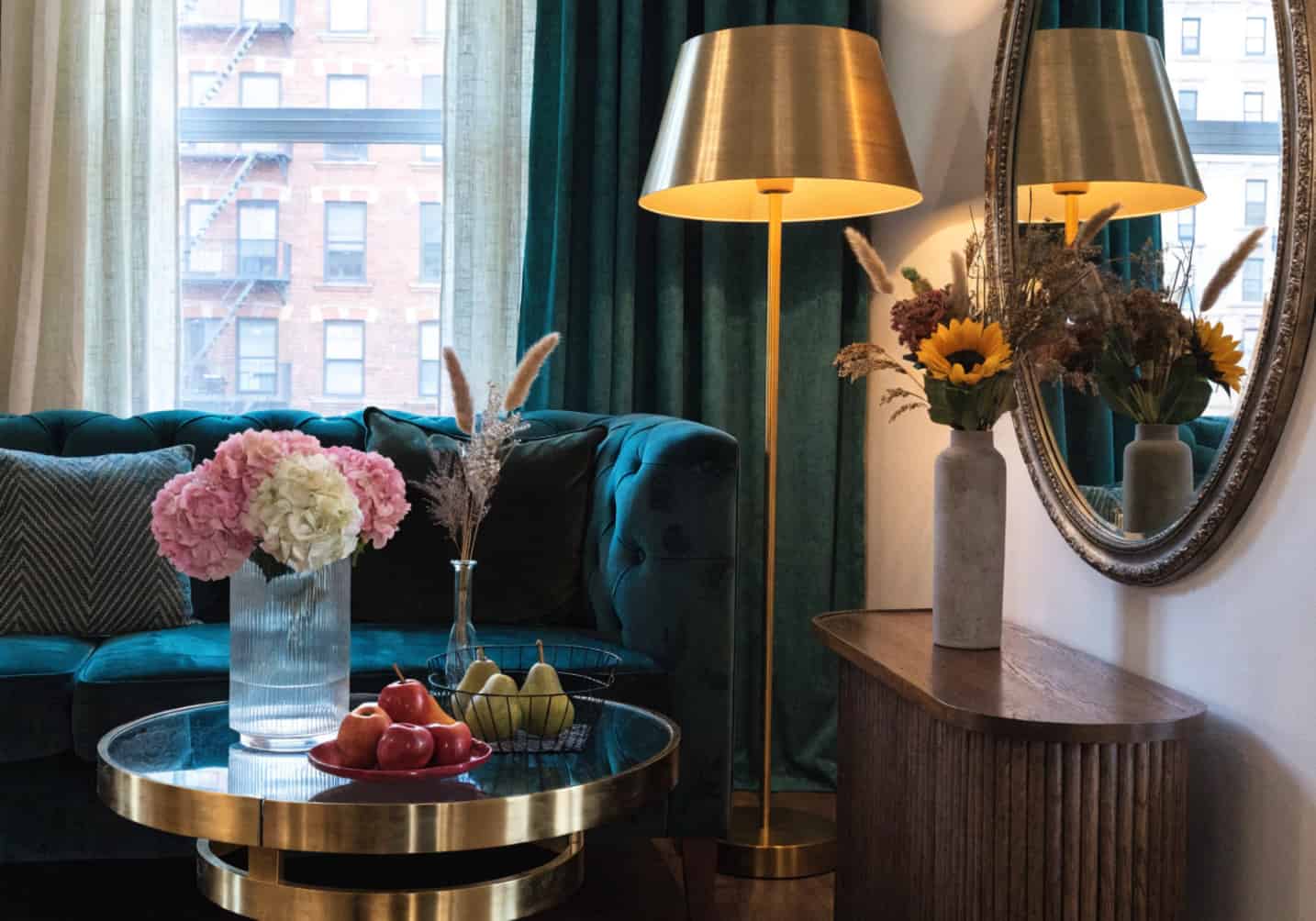 small living room with large wall mirror, reflected light, modern elegant decor