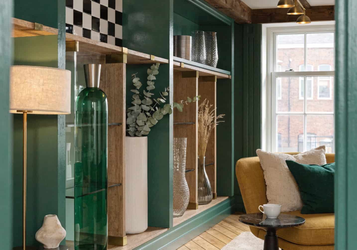 small living room with vertical shelves, wall storage, tall decor, modern interior