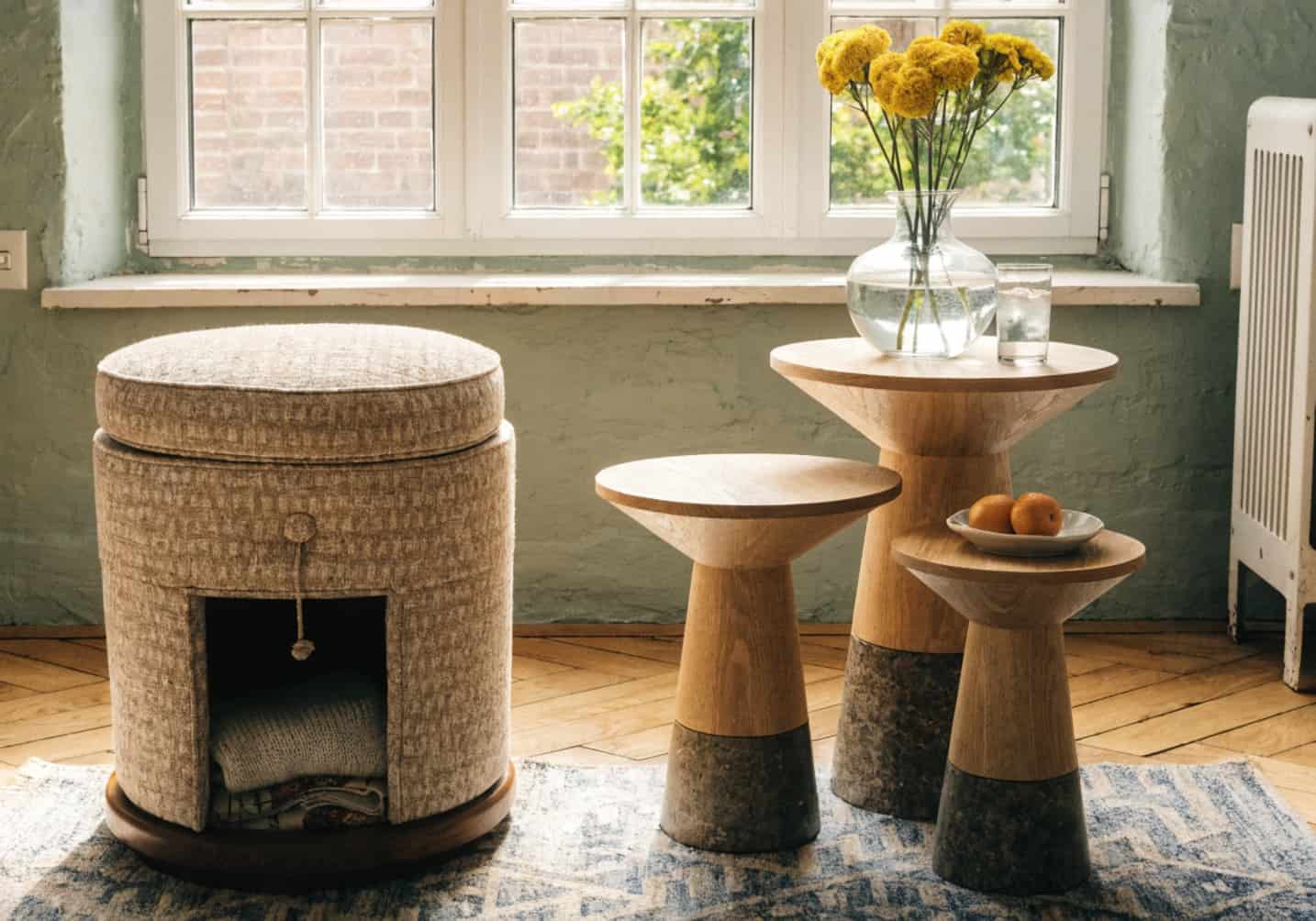 multifunctional furniture in small living room, storage ottoman, nesting tables