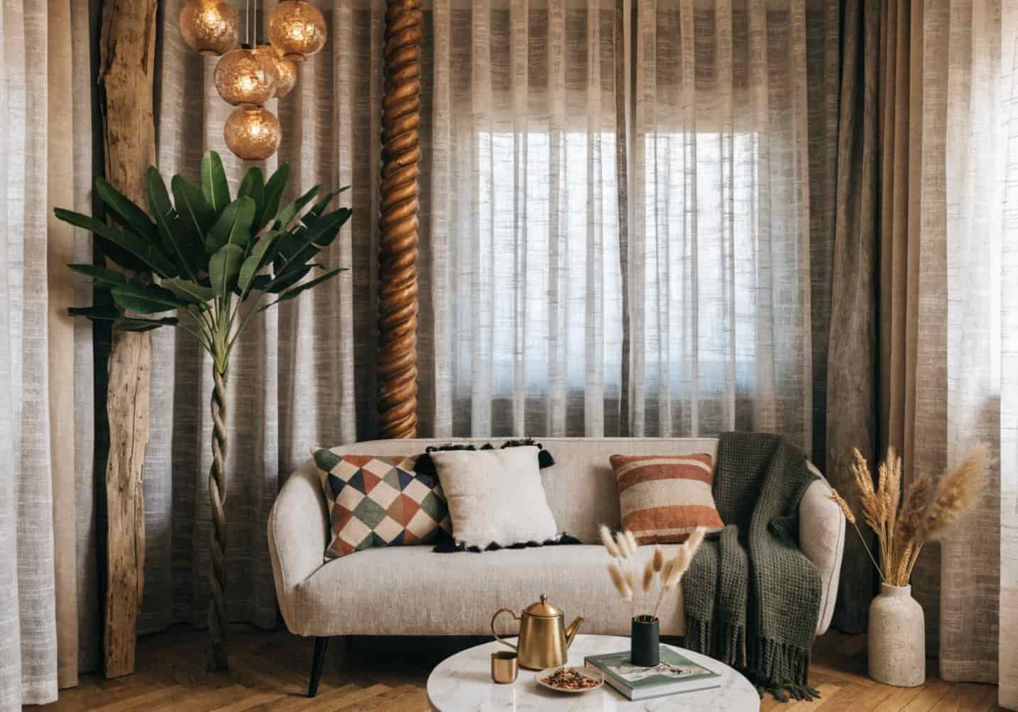 small living room with floor-to-ceiling curtains, tall plant, vertical decor elements