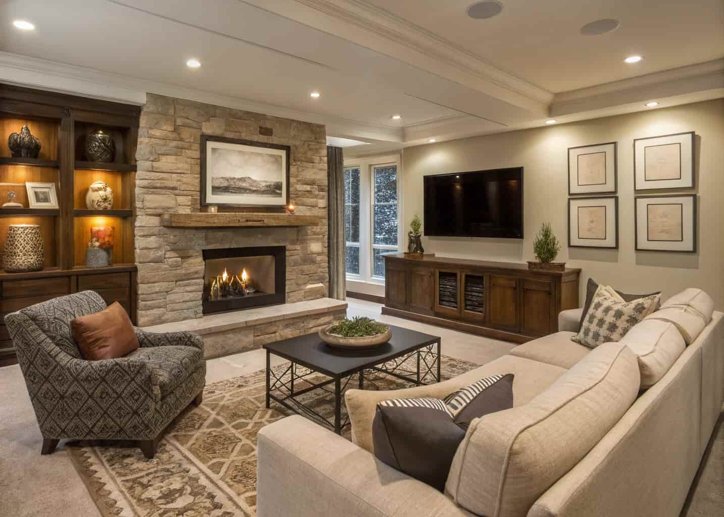 living room with statement fireplace and TV, modern cozy seating, layered decor