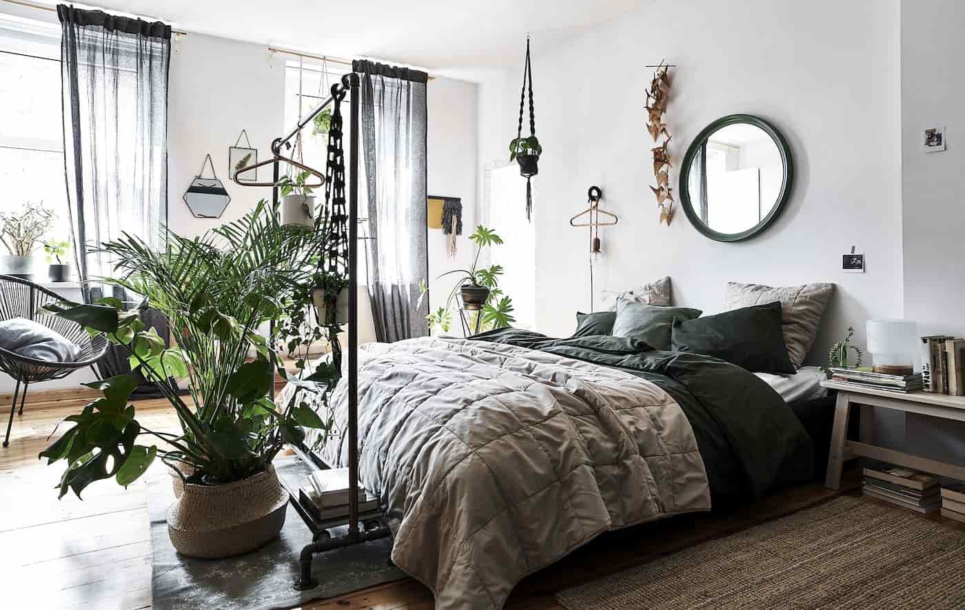 Pinterest-worthy bedroom with layered bedding, neutral tones, indoor plants, stylish furniture, ambient lighting, cozy aesthetic photography”